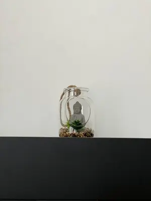 a small glass jar with a plant in it at L Escapade Urbaine in Brussels