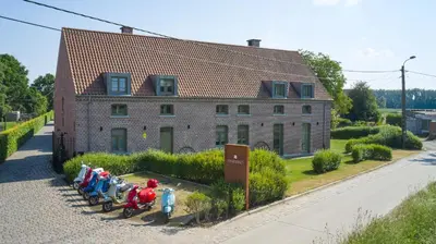 a group of figurines in front of a building at B&B Vossebergen Hombeek in Hombeek