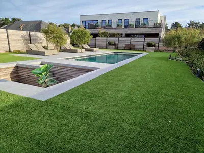 a house with a swimming pool and a lawn at Guesthouse Andor in Balen