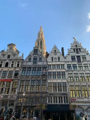 a large building with a clock tower on top of it at Hippe studio in historisch gebouw in oude centrum in Antwerp