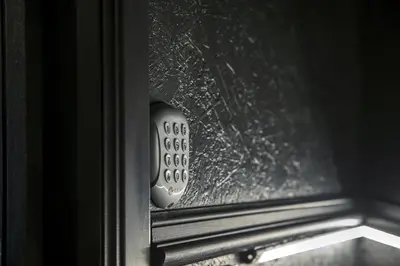 a close up of a remote control in a window at Secret Walls in Brussels