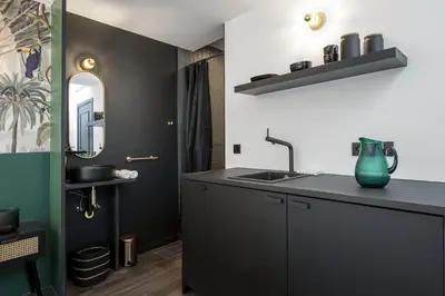 a bathroom with a sink and a mirror at Secret Walls in Brussels
