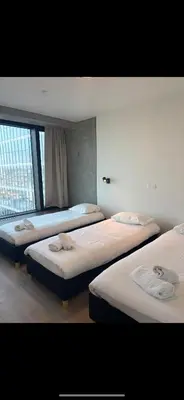 a group of three beds in a room at Apartment in Brussels City with Beautiful View in Brussels