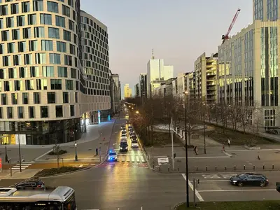 a city street with cars and buildings in a city at Apartment in Brussels City with Beautiful View in Brussels