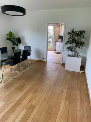 an empty room with a table and chairs and a room with a tableablish at Beautiful 3 bedroom Apartment in Antwerp