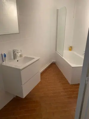 a bathroom with a sink and a shower and a tub at Beautiful 3 bedroom Apartment in Antwerp