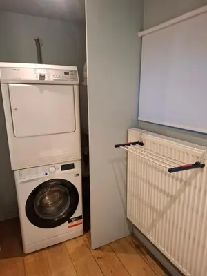 a washer and dryer in a small room at Loft aan Puyenbroeck in Wachtebeke