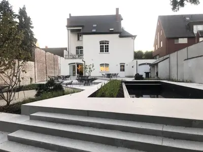 a building with stairs in front of a building at Visite in Evergem