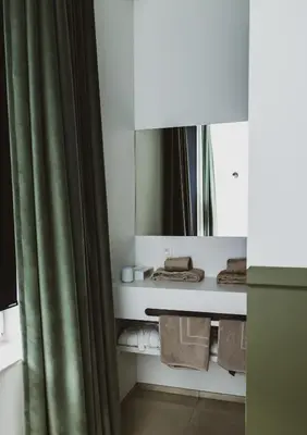 a bathroom with a mirror and a shower curtain at Visite in Evergem