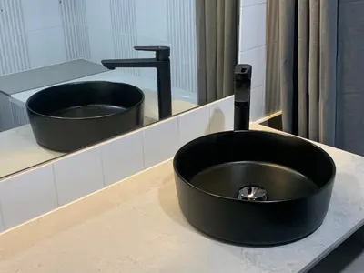 a black sink on a counter in a bathroom at OccO in Willebroek