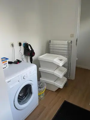 a laundry room with a washing machine and a washer at House between Antwerp and Brussels in Rumst
