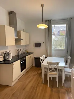 a kitchen and dining room with a table and chairs at House between Antwerp and Brussels in Rumst