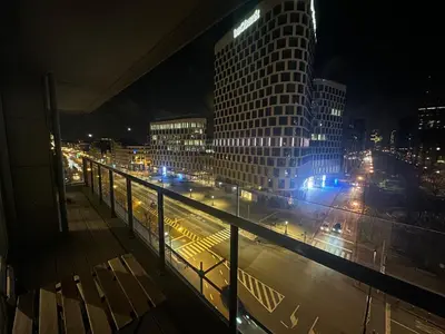 a view of a city at night with traffic at Apartment with Stunning View in City Center in Brussels
