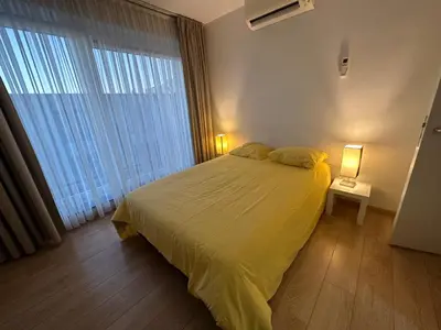 a bedroom with a bed and a large window at Apartment with Stunning View in City Center in Brussels