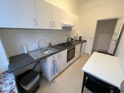 a kitchen with a sink and a counter top at Cosy Apartment Merode 2 in Brussels