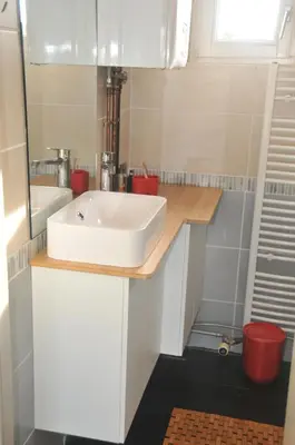 a bathroom with a white sink and a mirror at at Number 1 in Rumst