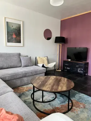 a living room with a couch and a coffee table at Apartment 202 in Ghent