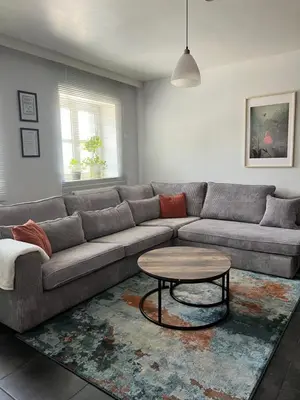 a living room with a couch and a table at Apartment 202 in Ghent