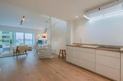 a kitchen with a sink and a counter top at ANCHOR LODGE ANTWERP Unique Appartment view MAS! in Antwerp