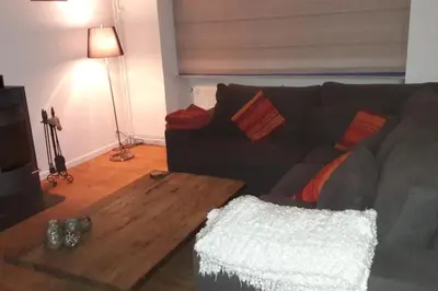 a living room with a couch and a coffee table at charming house with 3 bedrooms & terrace 10 minutes from city centre in Antwerp