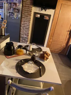 a table in a kitchen with a plate of food on it at CasaDeKaMa in Evergem