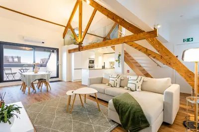 a living room with a couch and a table at Loft Gent in Ghent