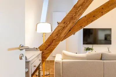 a living room with a couch and a lamp at Loft Gent in Ghent