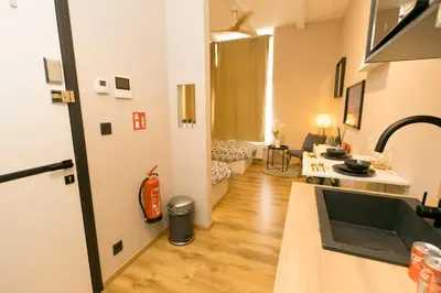 a living room with a sink and a kitchen at Golden Dove Luxury Aparts in Brussels