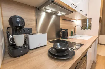 a kitchen with a mixer and a bowl on a counter at Golden Dove Luxury Aparts in Brussels