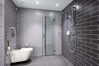 a bathroom with a shower and a toilet in it at Holiday Inn Express Antwerp - City Centre by IHG in Antwerp