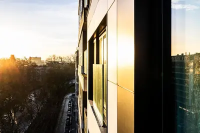 a window of a building with a view of a city at L-Avenue in Brussels