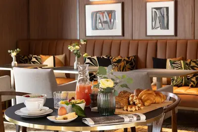 a table with a tray of food on it at L-Avenue in Brussels