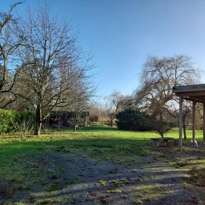 a park with a bench in the grass at Vakantiewoning Den Appel in Dendermonde