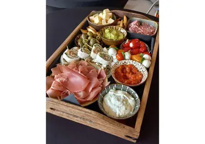 a tray of food with different types of food at 'De Zandrug' vakantiehoeve - B&B in Stekene