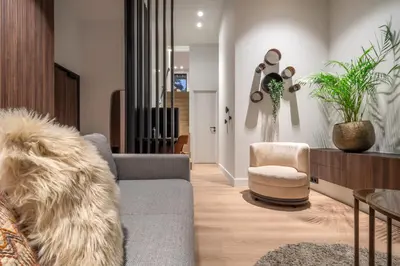 a living room with a couch and a chair at ONE TWO FOUR - Hotel & Spa in Ghent