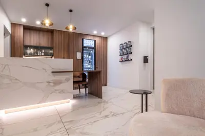 a lobby with a bar with a chair and a counter at ONE TWO FOUR - Hotel & Spa in Ghent
