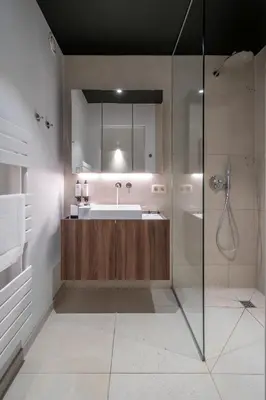 a bathroom with a sink and a shower at ONE TWO FOUR - Hotel & Spa in Ghent