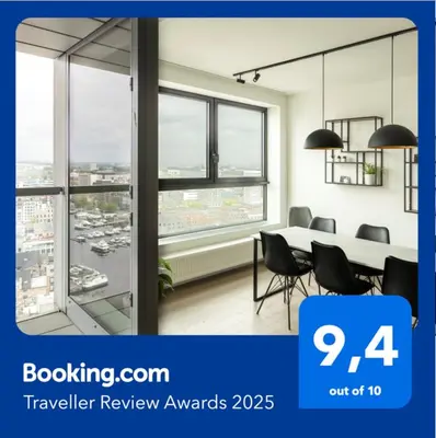 a meeting room with a table and chairs and windows at UNIEK appartement - mooiste en hoogste uitzicht op Antwerpen! - incl gratis parking in Antwerp