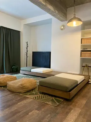 two beds on the floor in a room at Quest house in the city in Ghent