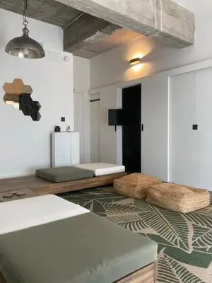 a living room with a bed and a couch at Quest house in the city in Ghent