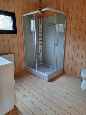 a bathroom with a glass shower in a room at Station 25A in Duffel