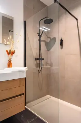 a bathroom with a shower and a sink at Sunny haven in Antwerp