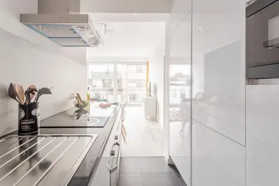 a kitchen with white walls and a counter top at Center of Antwerp, Fully Equipped, Train Station in Antwerp