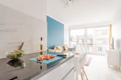 a kitchen with a counter with a bowl of fruit on it at Center of Antwerp, Fully Equipped, Train Station in Antwerp