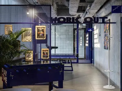 a lobby with a sign that reads work out at Adagio Access Gent Centrum Dampoort in Ghent
