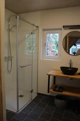a bathroom with a shower and a sink at 't Jongehof in Zaffelare