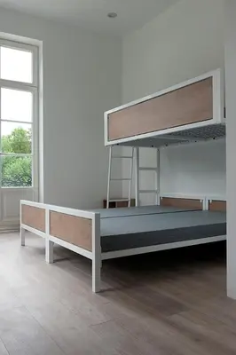 a white room with a bunk bed and a window at Kasteel Boterlaerhof Antwerpen in Antwerp