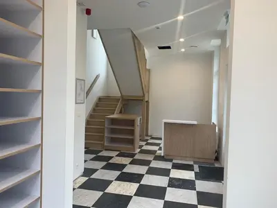 an office with a checkered floor and stairs at Kasteel Boterlaerhof Antwerpen in Antwerp