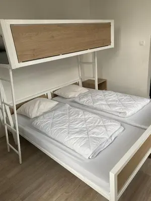 a large white bunk bed in a room at Kasteel Boterlaerhof Antwerpen in Antwerp