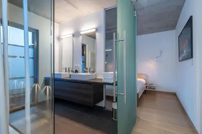 a bathroom with a sink and a mirror at London 993 Loft 402 in Antwerp